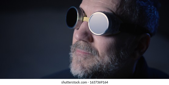 Close-up Of Of A Safety Goggles Wearing Man Looking Up