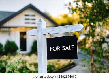 Close-up of for sale sign in font of house, real estate sign, open house, American real estate, USA - Powered by Shutterstock