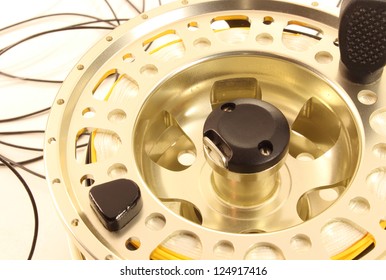 Close-up Of A Saltwater Fly Fishing Reel On A White Background.