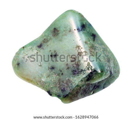closeup of sample of natural mineral from geological collection - tumbled Grossular (green garnet) gem stone isolated on white background