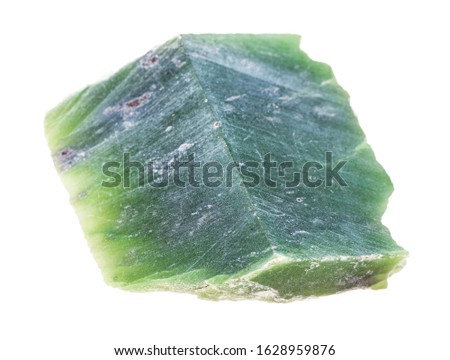 closeup of sample of natural mineral from geological collection - polished raw Nephrite (green jade) stone isolated on white background