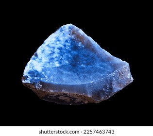 Close-up of sample raw flint stone. Macro shooting of specimen of blue natural raw mineral flint rock solated on black background. Selective focus. - Shutterstock ID 2257463743