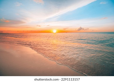 Closeup of sand on beach and blue summer sky. Panoramic beach landscape. Empty tropical beach and seascape. Orange and golden sunset sky, soft sand, calmness, tranquil relaxing sunlight, summer mood