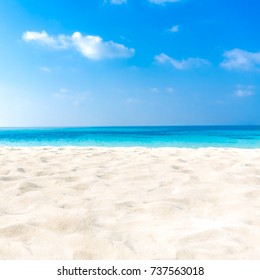 Closeup Of Sand On Beach And Blue Summer Sky 