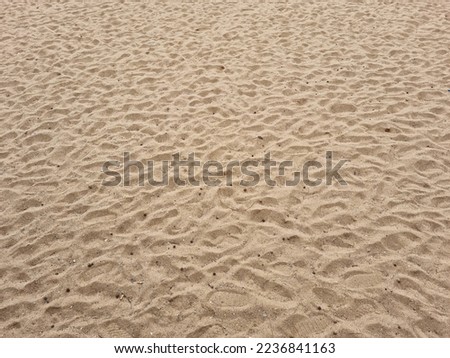 closeup of sand pattern of a beach in the summer