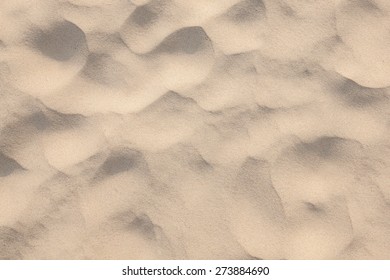 closeup of sand pattern of a beach in the summer/sand texture