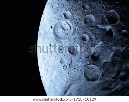 Closeup of a satellite surface in the solar system. Craters and reliefs on the moon's surface.