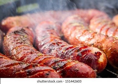 Closeup Of Sausage On The Grill