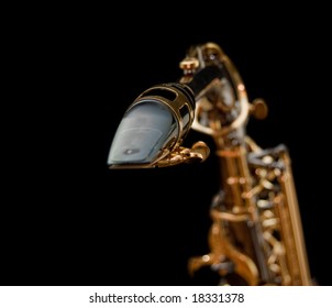 Close-up Of A Saxophone Mouthpiece Isolated In Black Background