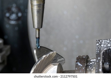 Closeup scene  5-axis  machining center cutting the boat propeller parts with solid ball end mill tool. The hi-precision part manufacturing process by multi-axis CNC milling machine.