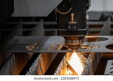 Close-up scene the fiber laser cutting machine cutting  machine cut the metal plate. The hi-technology sheet metal manufacturing process by laser cutting machine. 