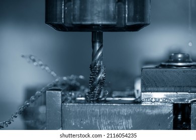 The Closeup Scene Of Machine Tapping Process On CNC Machine. The Threading Process On Machining Center.