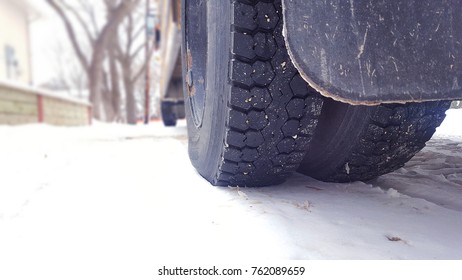 Close-up Of School Bus Winter Tire In The Snow.