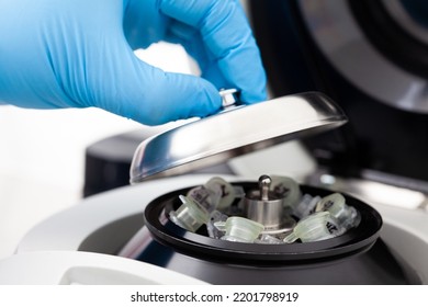 Closeup Of A Scientist Closing An Small Table Centrifuge Filled With Tubes. Spin Column-based Nucleic Acid Purification Technique. Diagnosis Of Human Papillomavirus Virus Infection.