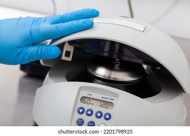 Closeup Of A Scientist Closing An Small Table Centrifuge Filled With Tubes. Spin Column-based Nucleic Acid Purification Technique. Diagnosis Of Human Papillomavirus Virus Infection.