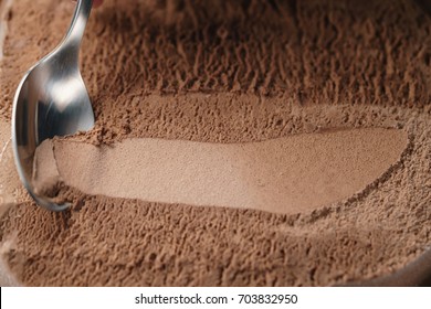 Closeup Scooping Chocolate Ice Cream With Spoon