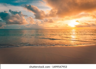 Closeup of sea beach and colorful sunset sky. Panoramic beach landscape. Empty tropical beach and seascape. Orange and golden sunset sky, soft sand, calmness, tranquil relaxing sunlight, summer mood - Shutterstock ID 1499547953
