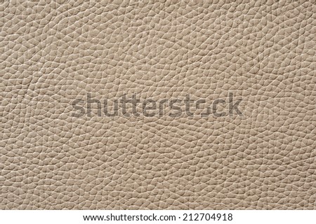 Closeup of seamless beige leather texture for background