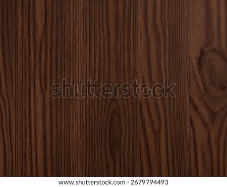 A close-up, seamless texture of dark brown wood grain featuring vertical lines and occasional warm golden streaks.