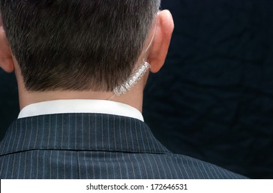 Close-up Of A Secret Service Agent, Behind.