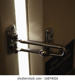 Close-up Of Security Lock On Motel Or Hotel Room Door.