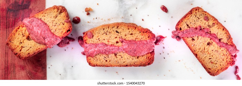 A close-up of a seed cake with ruby chocolate, shot from above