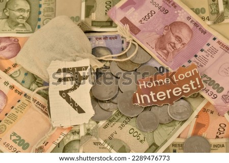 A closeup selective focus picture of Indian currency with Text Home loan Interest
