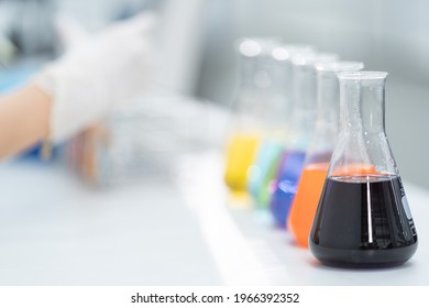 Close-up And Selective Focus Shoot Of A Microscope, Medical Test Tubes With Liquid, And Other Modern Laboratory Equipment In A Laboratory Room. Education Stock Photo