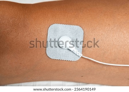 Closeup of a self-adhesive electrode pad used in TENS (transcutaneous electrical nerve stimulation) and EMS (electronic muscle stimulation) therapy units