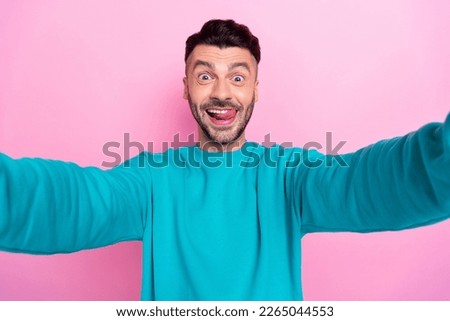 Closeup selfie cadre photo of young funky childish student brunet hair man lick teeth tongue hungry symbol isolated on pink color background