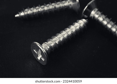 Close-up of self-tapping screw. Crosshead screw slot