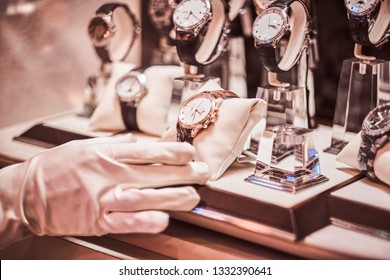 Close-up Of The Seller's Hand In Gloves Shows The Exclusive Men's Watch From The New Collection In The Luxury Jewelry Store