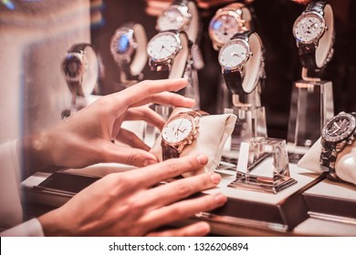 Close-up Of The Seller's Hand Shows The Exclusive Men's Watch From The New Collection In The Luxury Jewelry Store