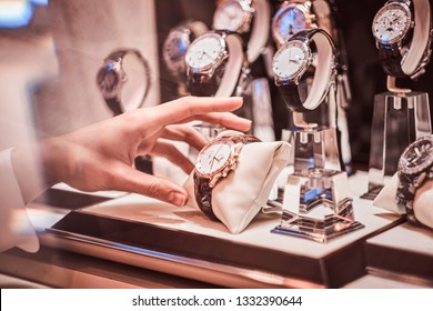 Close-up Of The Seller's Hand Shows The Exclusive Men's Watch From The New Collection In The Luxury Jewelry Store