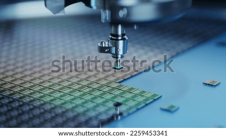 Close-up of Semiconductor Packaging Process. Computer Chips are being Extracted by a Pick and Place Machine from Wafer and Attached to Substrate. Computer Chip Manufacturing at Factory