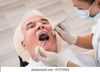 Close-up Of A Senior Man Undergoing Dental Treatment In Clinic