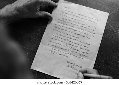 Closeup Of Senior Man Writing Letter