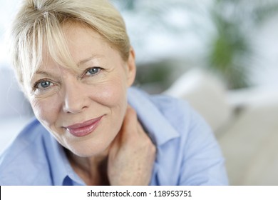 Closeup of senior woman with blue shirt