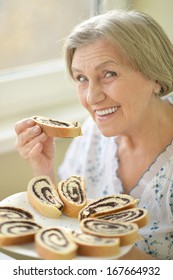 Closeup Of A Senior Woman Eating Poppy Pie