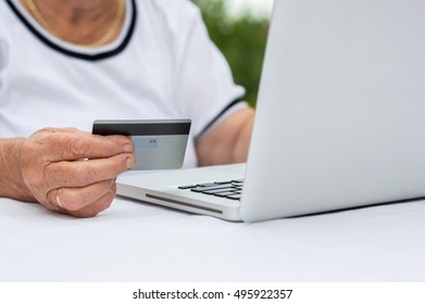 Closeup Of Senior Woman Hand With Credit Card. 