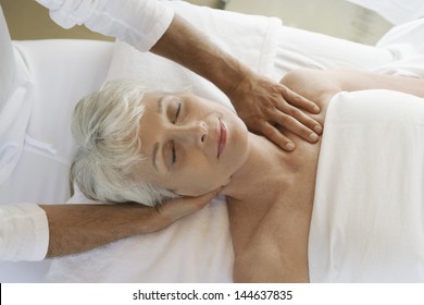 Closeup Of A Senior Woman Receiving Massage At Spa