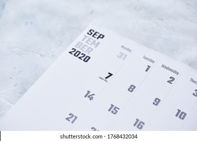 A Closeup Of A September 2020 Calendar Focusing On Labor Day, On A White Textured Surface