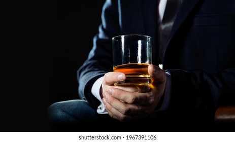 Closeup Of Serious Businessman Holding Whiskey Illustrate Executive Privilege Concept.