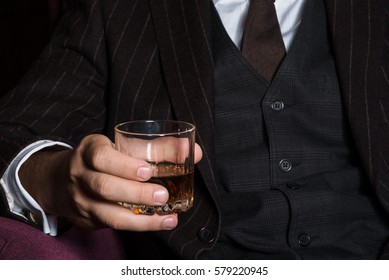 Closeup Of Serious Businessman Holding Whiskey Illustrate Executive Privilege Concept