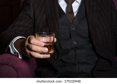 Closeup Of Serious Businessman Holding Whiskey Illustrate Executive Privilege Concept