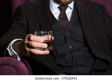 Closeup Of Serious Businessman Holding Whiskey Illustrate Executive Privilege Concept