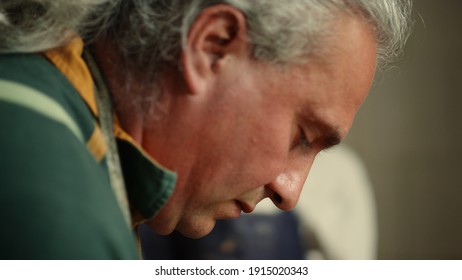 Closeup Serious Master Doing Handicraft In Workshop. Portrait Of Focused Artist Teaching In Studio. Senior Man Concentrating On Clay Sculpting In Pottery.