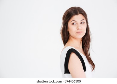 Closeup Of Serious Young Woman Looking Away Over White Background