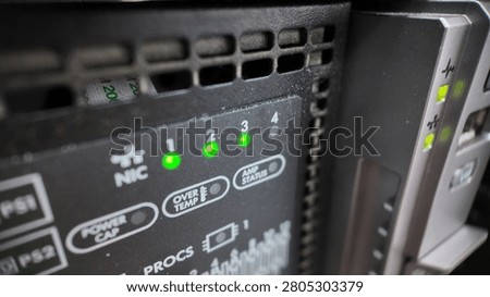 Close-up of Server Network Interface Card (NIC) Activity LEDs and System Status Panel on Rackmount Server