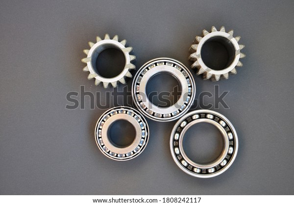 Close-up of a set of ball and roller bearings\
on a dark background